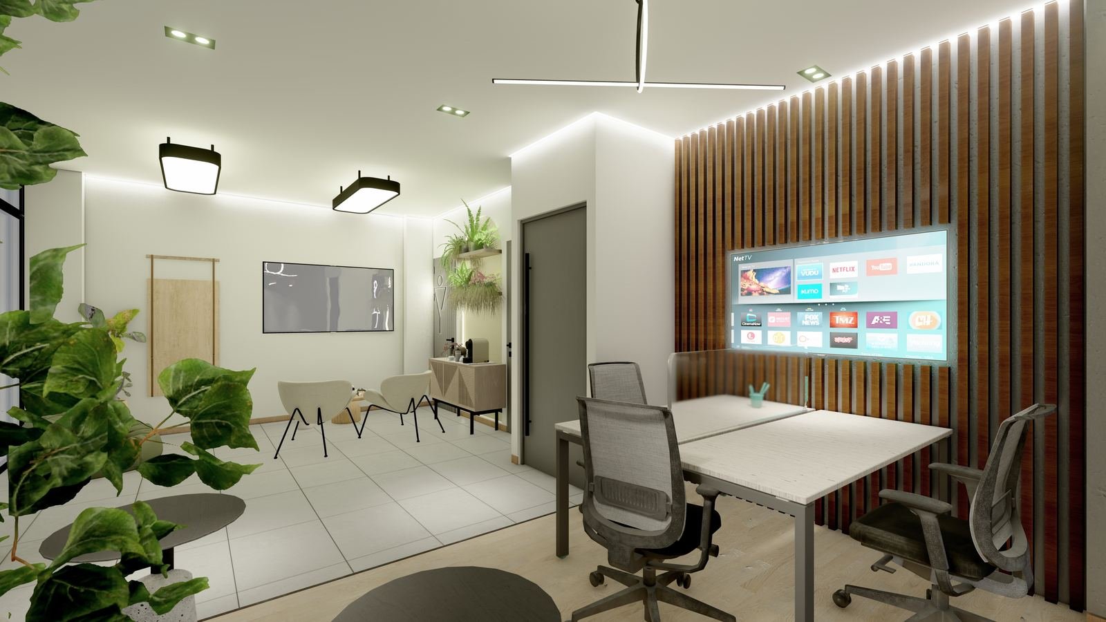 Zona de coworking y juegos de Do Living Suitépolis, con escritorios, pantalla, sillas y luz natural